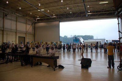 Coaches parked in front of the hanger at Dobbins Naval Air Station